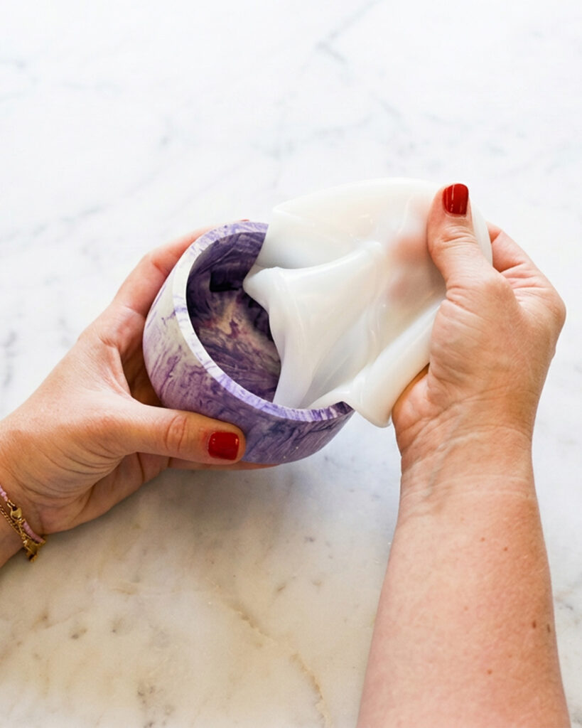 Hands demoulding a finished Jesmonite® piece