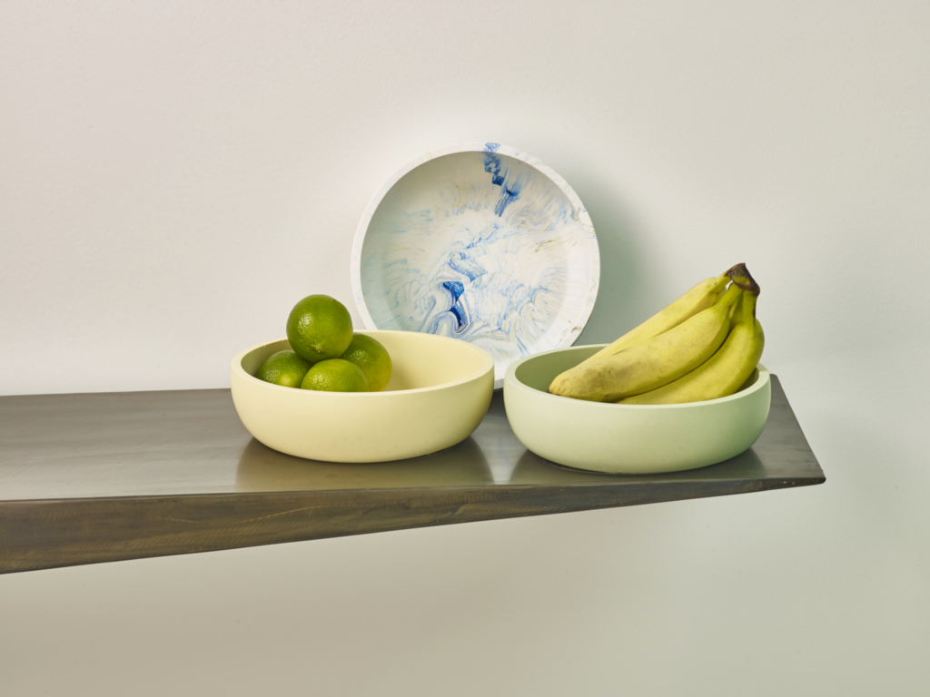 Jesmonite bowls holding whole fruit for display